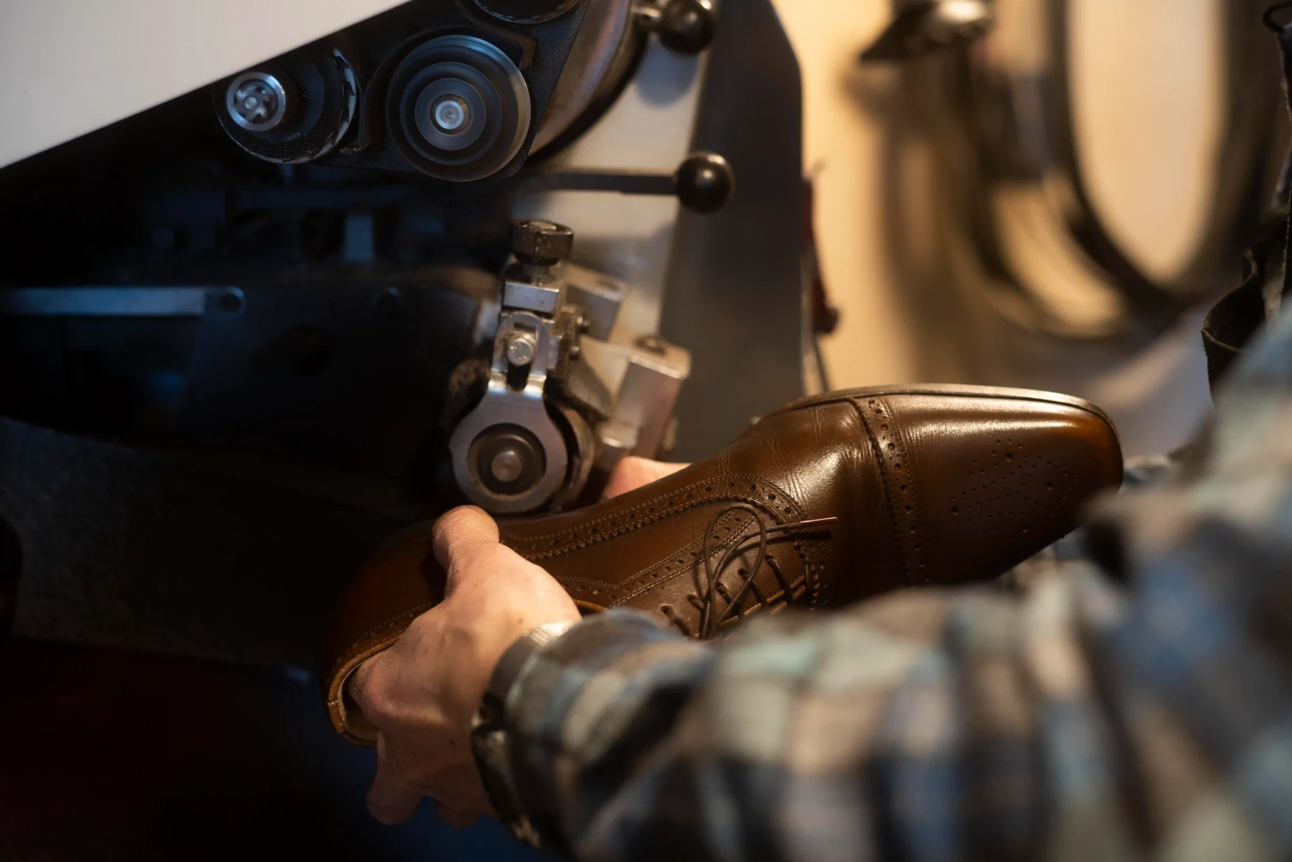 close-up-hands-making-shoe-scaled
